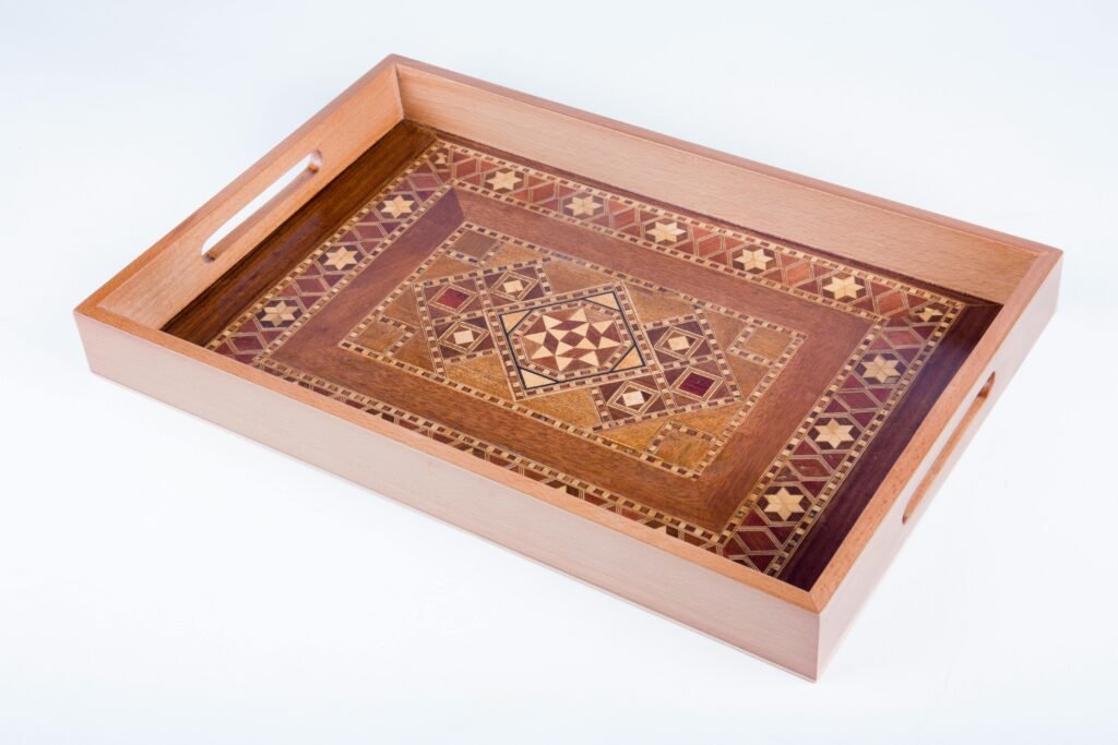 Home Elegant handcrafted wooden tray featuring detailed inlaid patterns. Perfect for decor or serving.