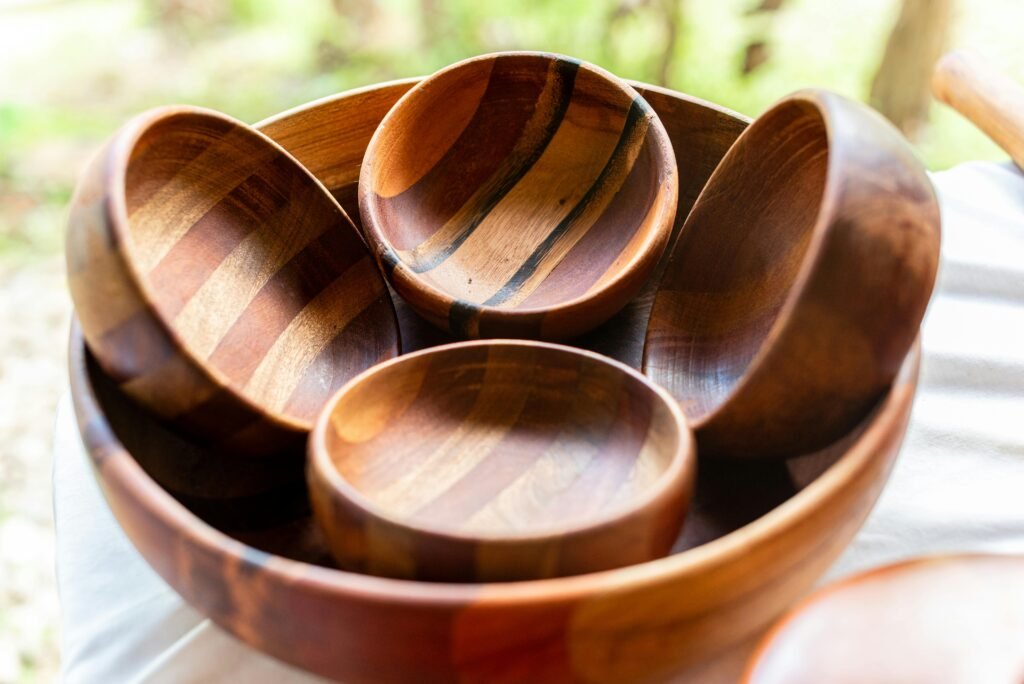 Home A collection of artisanal wooden bowls on display, showcasing natural craftsmanship.